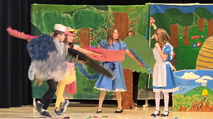 Kids perform in Alice in Wonderland