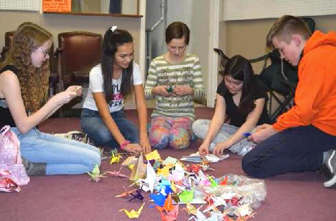 Kids fold A Thousand Cranes