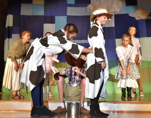 Two kids play cow in Jack and the Beanstalk Musical Play