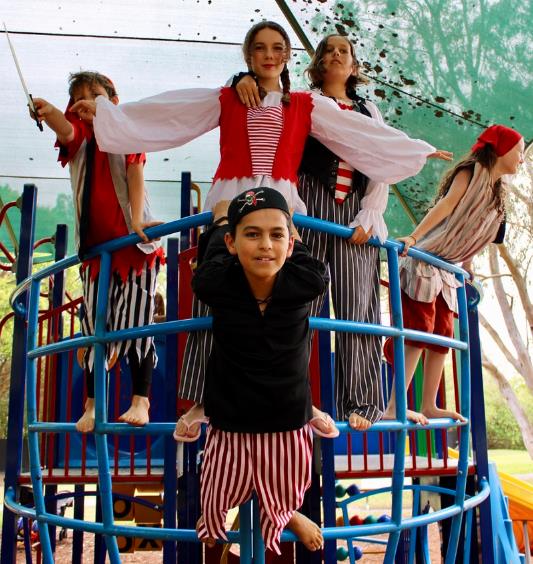 Kids play pirates in Treasure island play