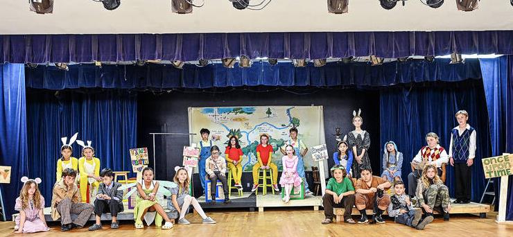 Young large cast of students in Winnie-the-Pooh play